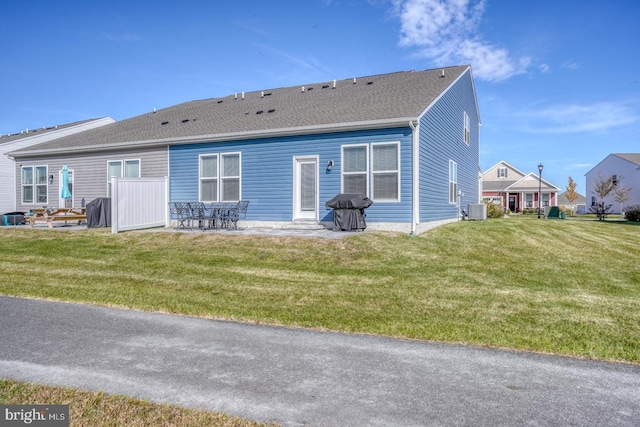 back of house with a patio, cooling unit, and a yard