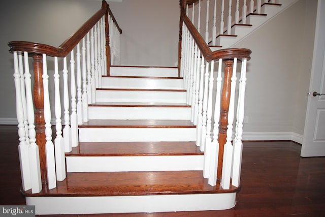 staircase featuring hardwood / wood-style flooring