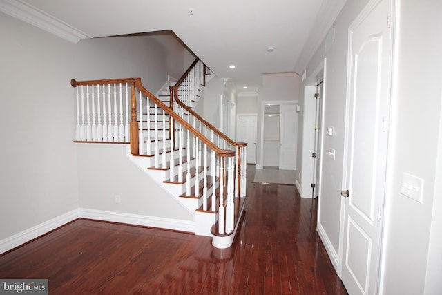 interior space with dark wood-type flooring and crown molding