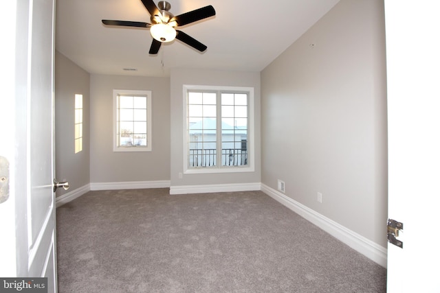 carpeted empty room with ceiling fan