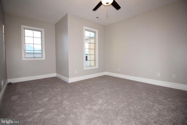 carpeted empty room with ceiling fan