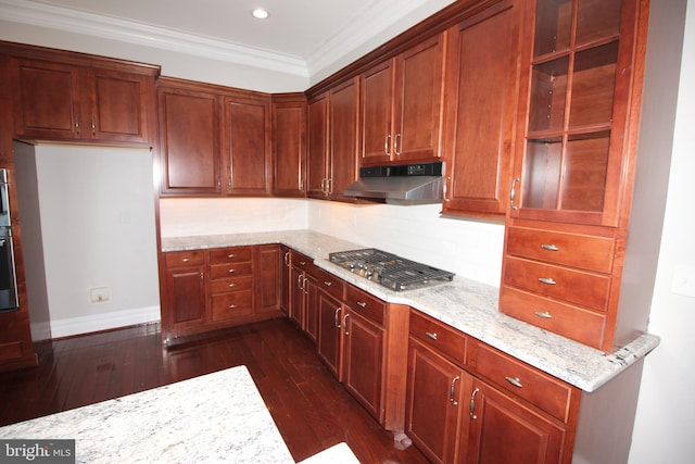 kitchen featuring ornamental molding, light stone countertops, stainless steel gas stovetop, dark wood-type flooring, and decorative backsplash