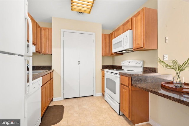 kitchen with white appliances and sink