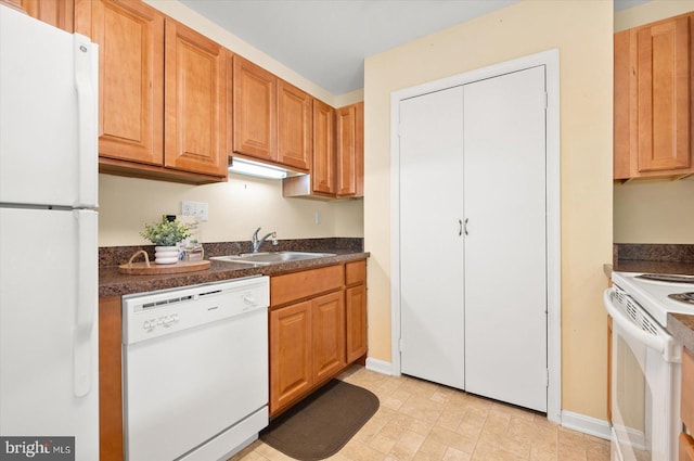 kitchen featuring sink and white appliances