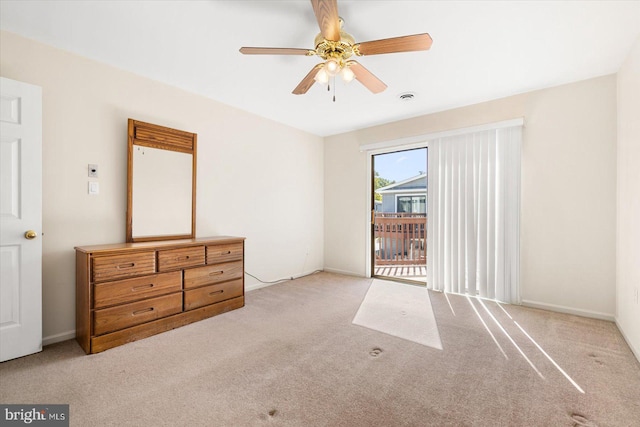 carpeted bedroom featuring access to outside and ceiling fan