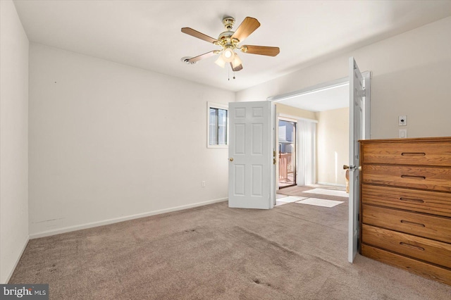 unfurnished bedroom featuring light colored carpet and ceiling fan