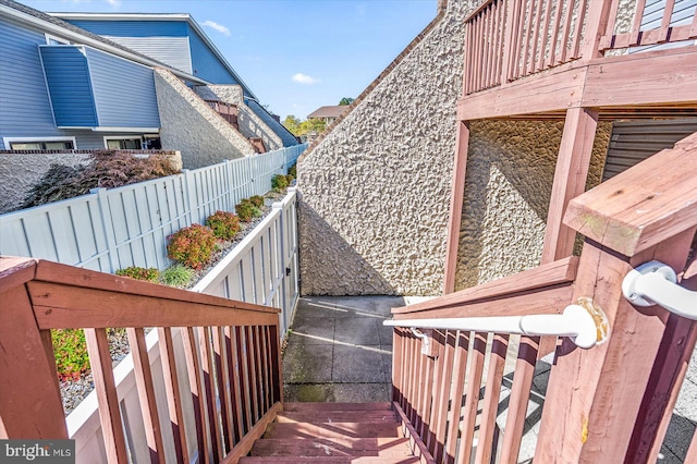 view of side of property featuring a deck