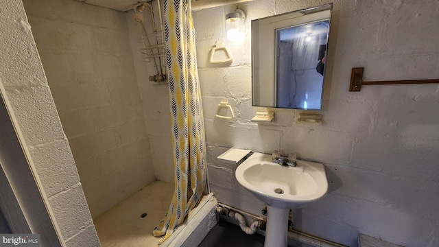 bathroom featuring sink and walk in shower