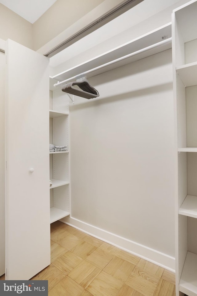 walk in closet featuring wood-type flooring