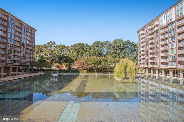 view of pool with a water view