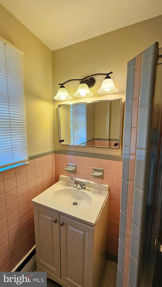 bathroom with vanity, tile walls, and tile patterned flooring