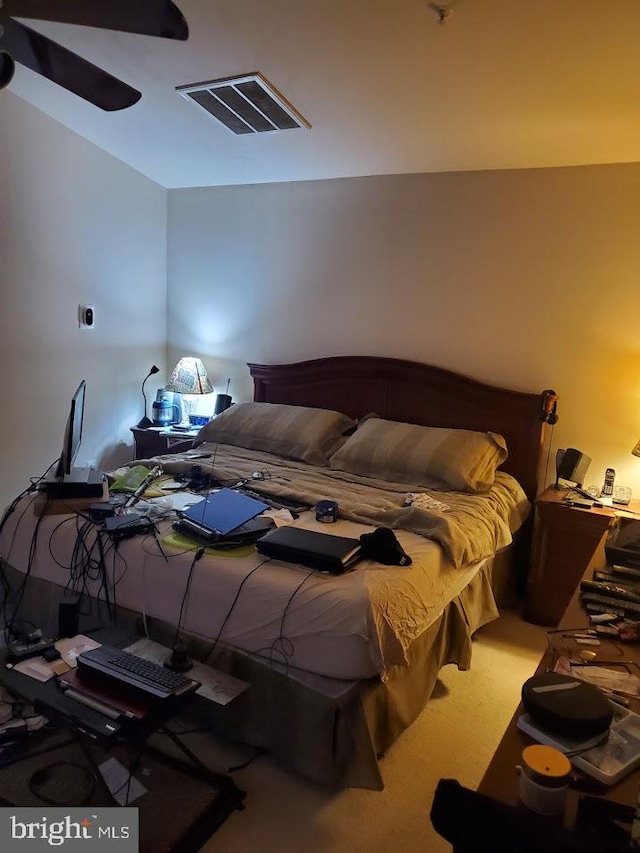 carpeted bedroom featuring ceiling fan