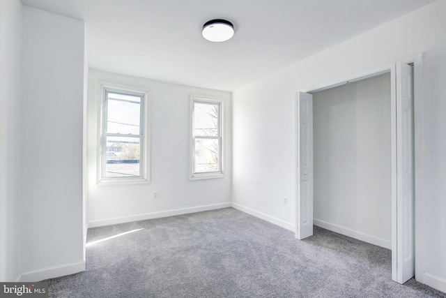 unfurnished bedroom with carpet