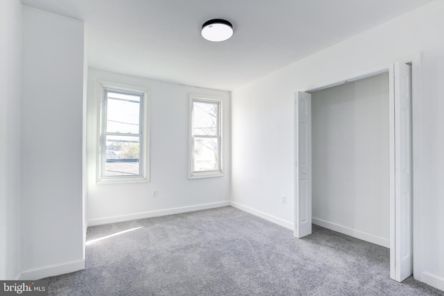 unfurnished bedroom with carpet floors