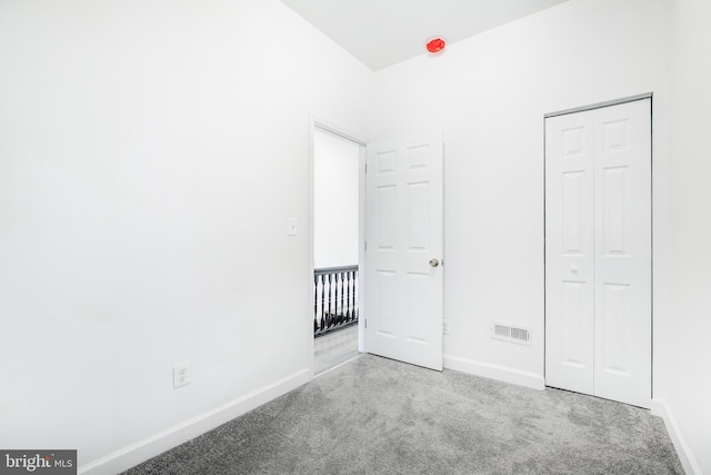 unfurnished bedroom with light carpet