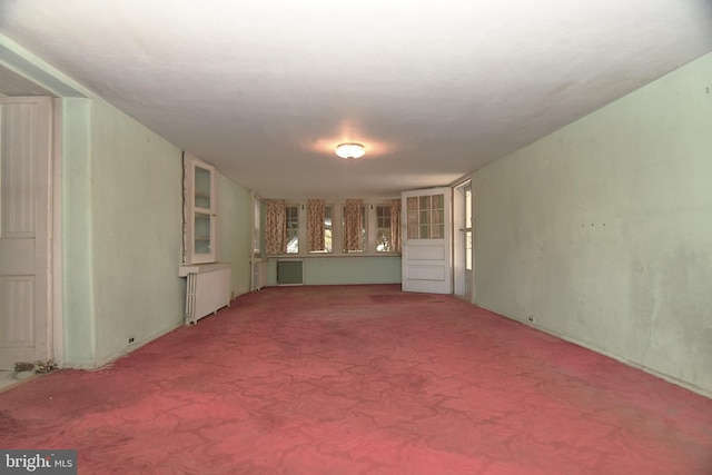 interior space featuring carpet floors and radiator