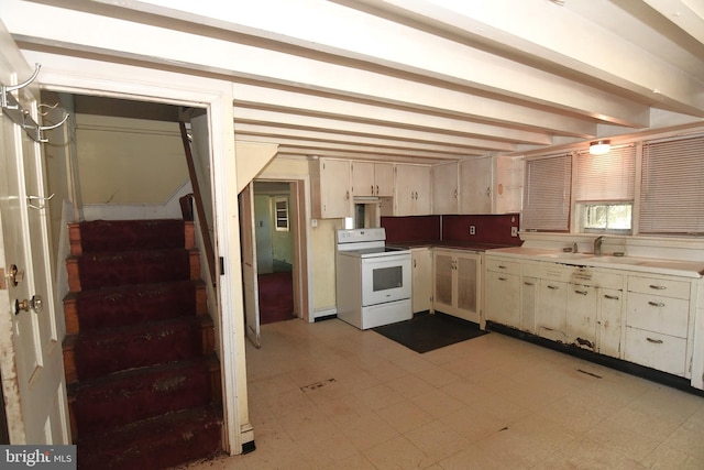 2761 York Rd, Jamison, PA 18929 - kitchen featuring cream cabinetry, electric range, beamed ceiling, and light floors