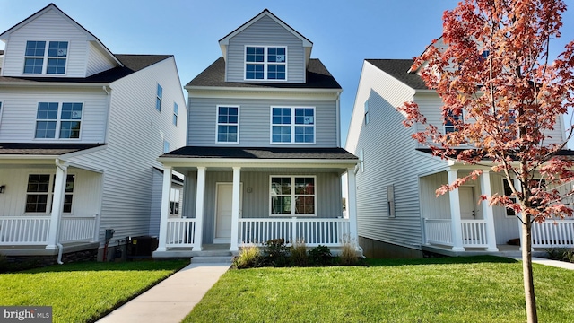 view of front of home featuring a porch and a front lawn