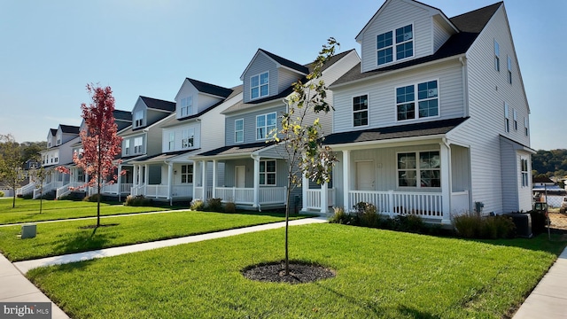 view of front facade featuring a front lawn and covered porch