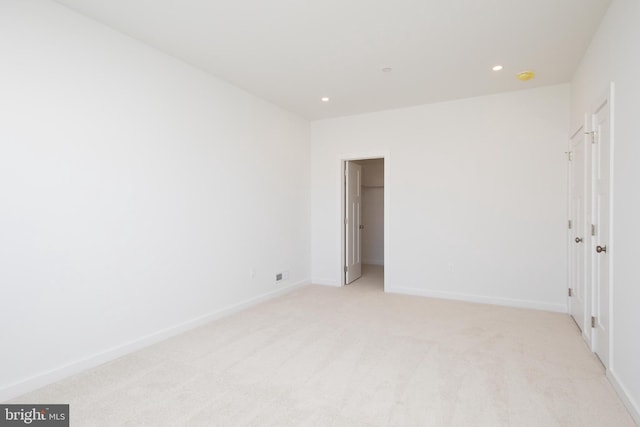 empty room with light colored carpet