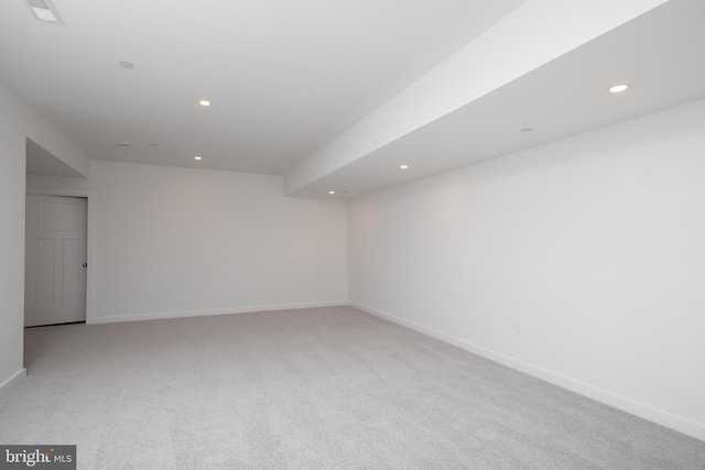 empty room featuring light carpet