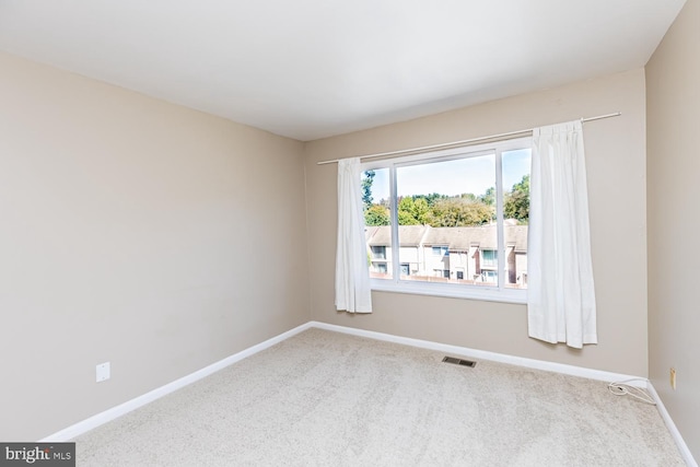 empty room featuring carpet floors