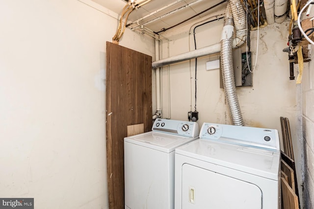 washroom with washing machine and clothes dryer