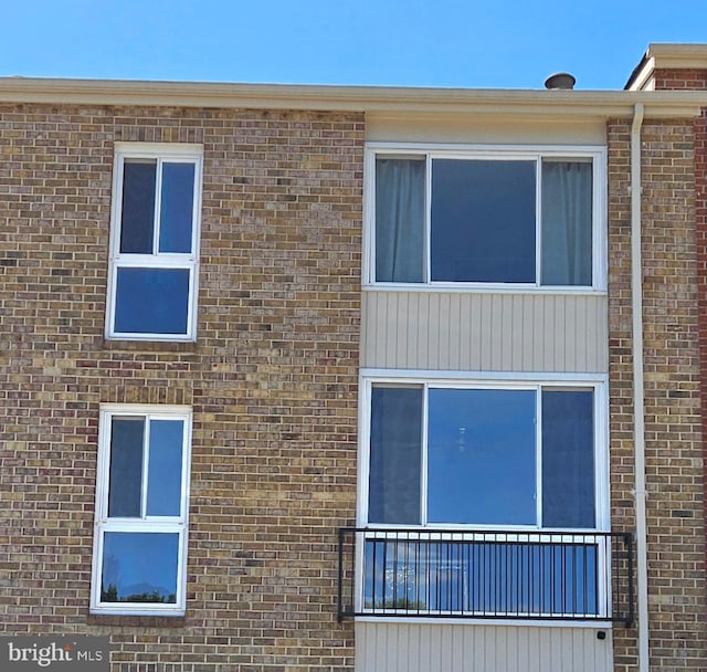 view of home's exterior with a balcony