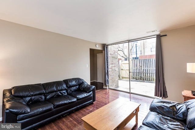 living room with dark hardwood / wood-style flooring