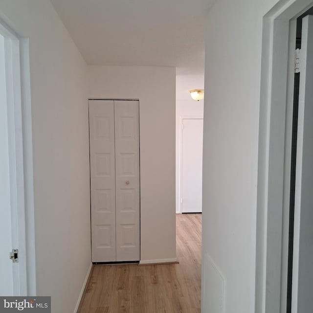 hallway featuring light hardwood / wood-style floors