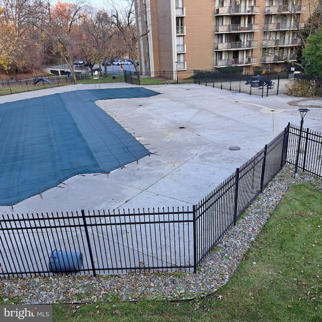 view of swimming pool featuring a patio