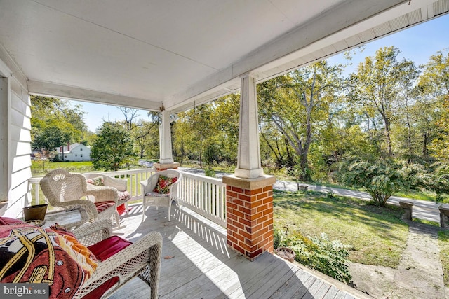 wooden terrace featuring a porch