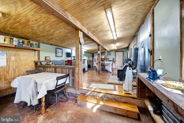 dining area featuring hardwood / wood-style floors, lofted ceiling, and wood ceiling