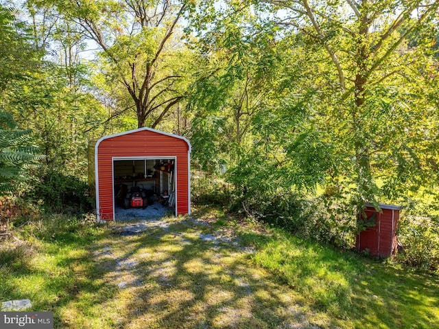 view of outdoor structure featuring a lawn