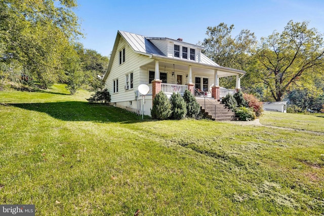 view of front facade with a porch and a front lawn