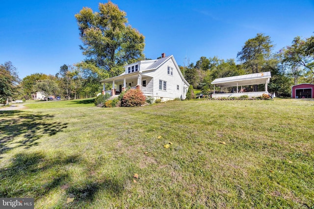 view of yard with covered porch