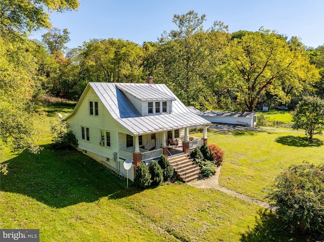 view of front of home featuring a porch and a front yard