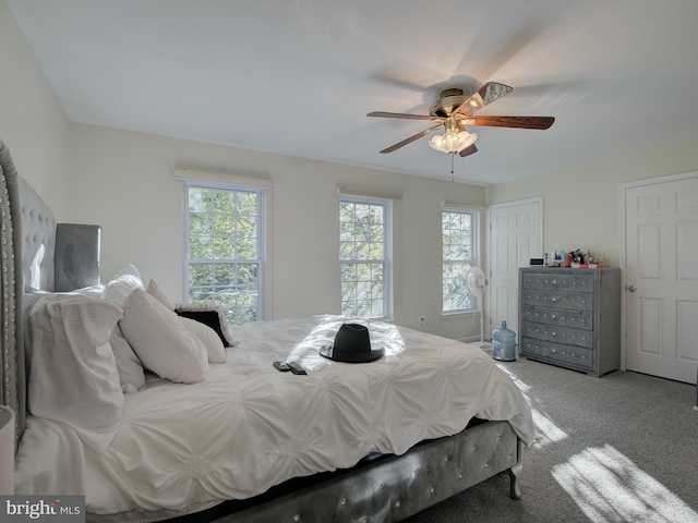 carpeted bedroom with ceiling fan