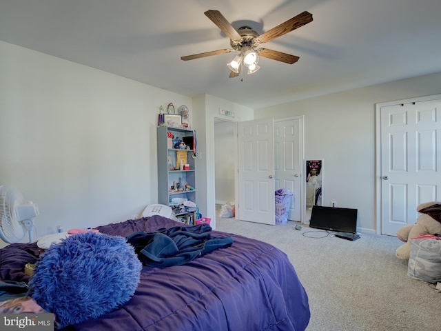 bedroom with ceiling fan and carpet floors