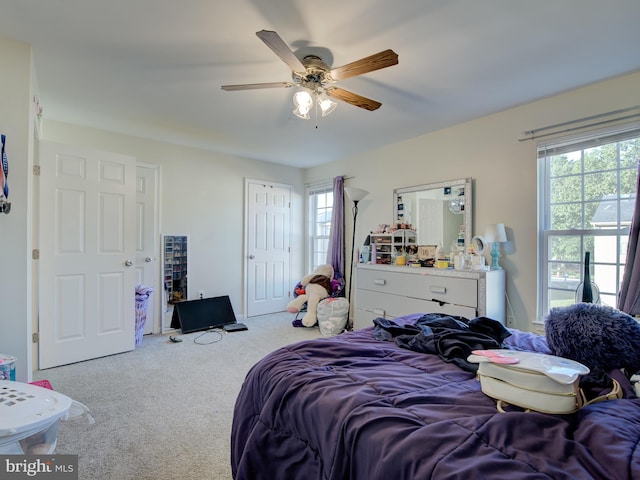 carpeted bedroom featuring ceiling fan