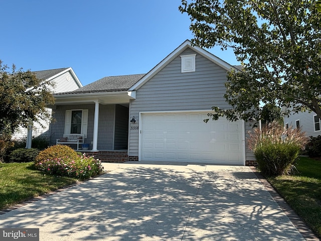 view of front of property featuring a porch and a garage