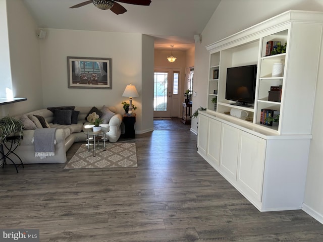 living room with ceiling fan, dark hardwood / wood-style flooring, and lofted ceiling