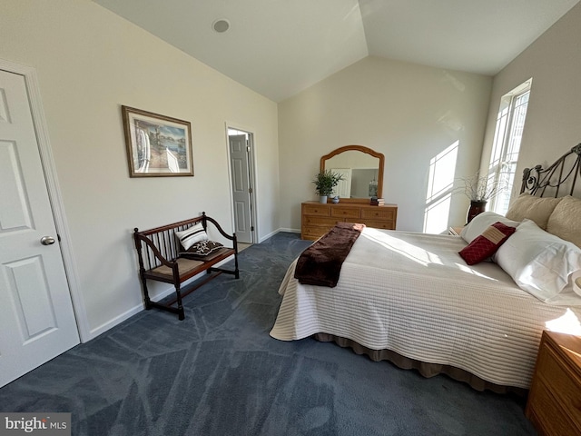 carpeted bedroom featuring lofted ceiling