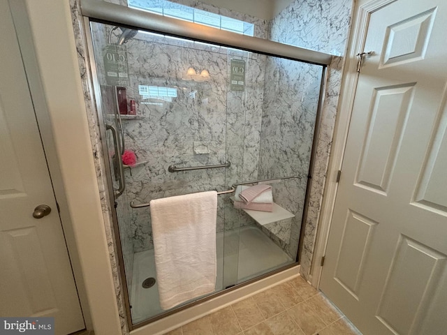 bathroom featuring tile patterned flooring and walk in shower