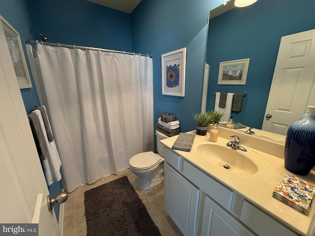 bathroom with tile patterned flooring, vanity, toilet, and curtained shower