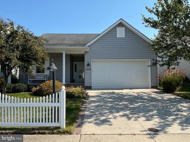 view of front facade featuring covered porch and a garage