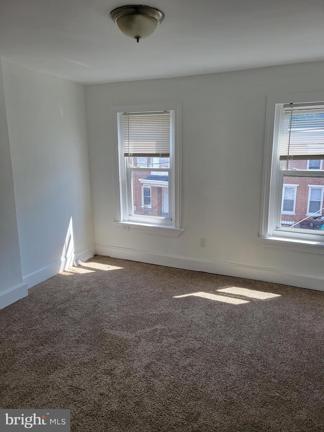 empty room with carpet flooring