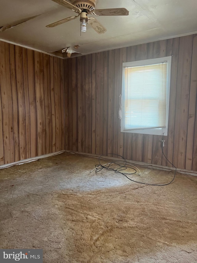 711 6th St, Pocomoke City, MD 21851 - empty room with a ceiling fan and wood walls
