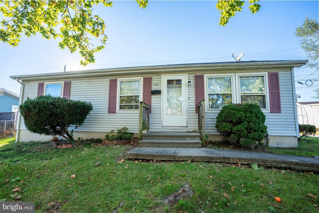 view of front of home with a front lawn