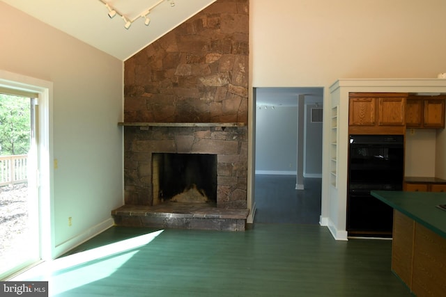 unfurnished living room with a fireplace, dark hardwood / wood-style floors, and high vaulted ceiling